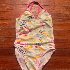 Adorable kids swimwear featuring a vibrant fish design. Perfect for fun days at